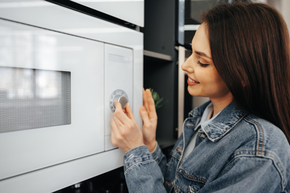 close-up-of-a-woman-checking-new-microwave-oven-in-hypermarket.jpg